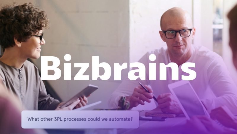 A group of professionals engaged in a discussion around a table. One person with curly hair uses a tablet, while another wearing glasses and a light-colored shirt holds a pen. Background features a white wall and natural light. Text overlay reads "Bizbrains" and a question about automating 3PL processes.